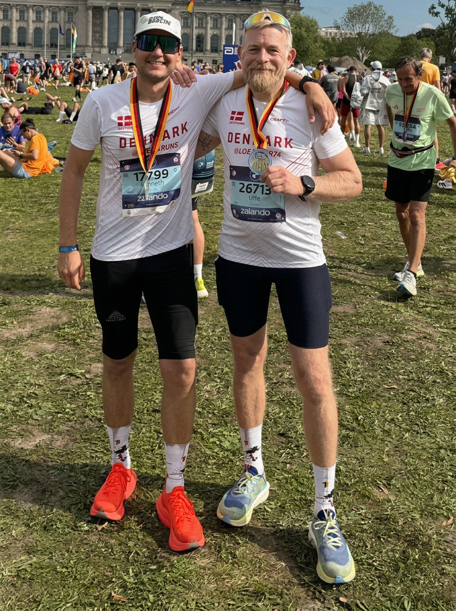 Two friends with finisher medals at Berlin Marathon